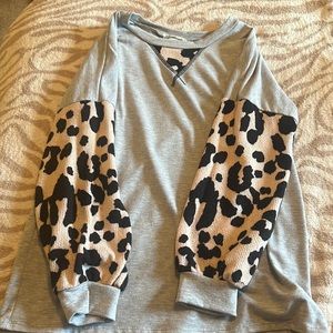 A long sleeve cheetah printed shirt